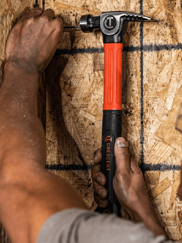 Crescent hammer hammering nail into board